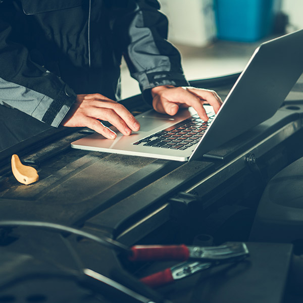 Car Mechanic with Computer