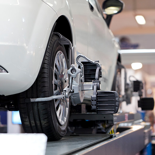 Car mechanics working and maintaining car